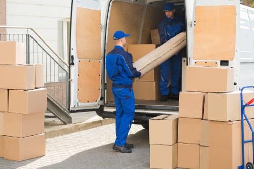 Removal boxes and furniture being prepared for a move in Scotland