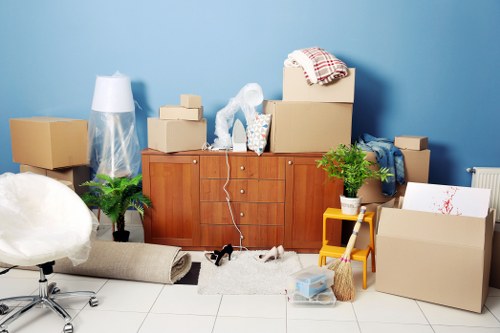 Furniture removal team collecting unwanted items from a Scottish property