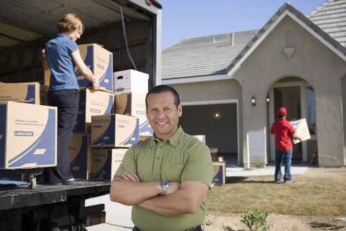 Professional movers preparing belongings for safe transport
