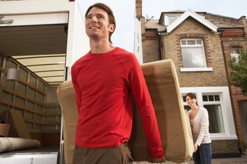 Staff handling items carefully during a removals operation
