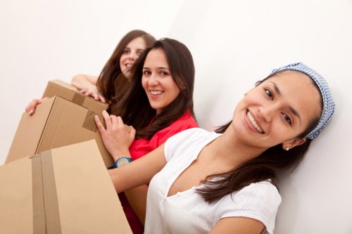 Professional movers carrying items during a same day relocation