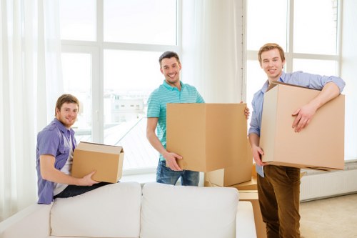 Professional movers preparing furniture for transport