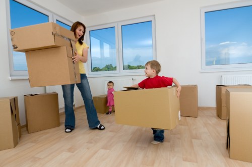 Professional movers packing boxes for a home relocation