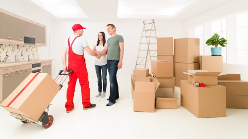 Team preparing moving boxes and protective packing materials in Scotland