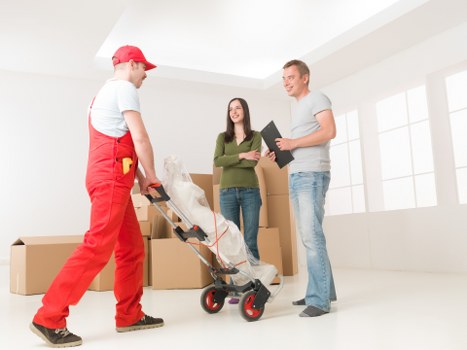 Professional office movers handling workspace furniture during relocation